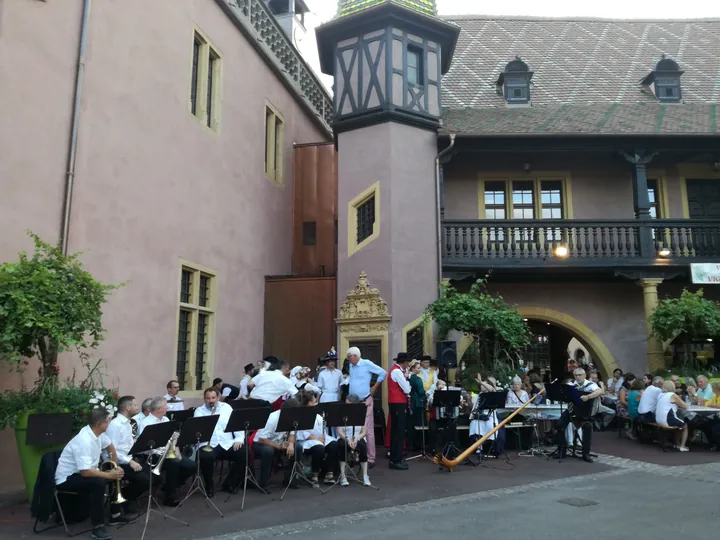 Folklore dancing in the evening at Colmar, Alsace (France)